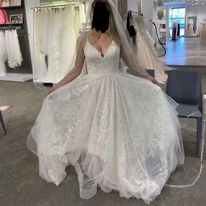 Wedding dress size 2 never worn or altered